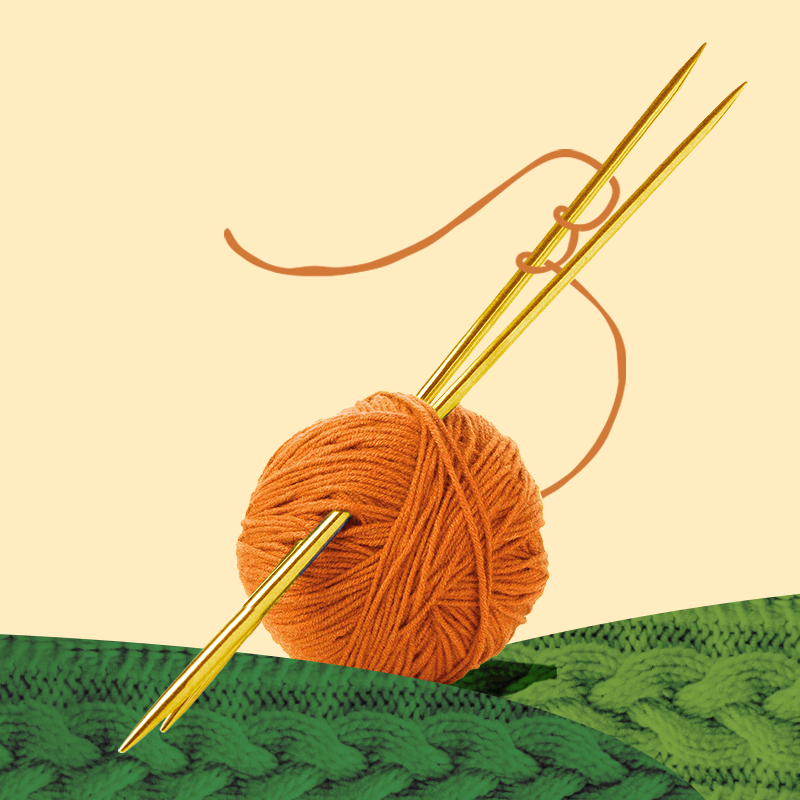 Stricknadeln und Wolle